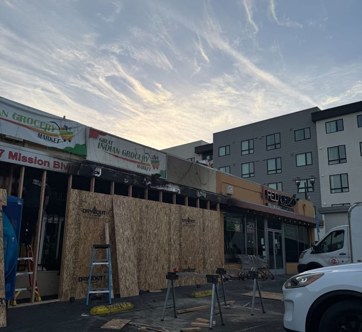 Photograph of fire damage to Great Indian Grocery Market and Red Chili.
